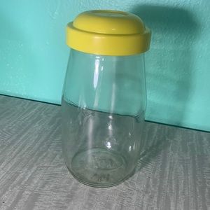 Vintage Action industries jar with yellow lid